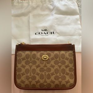 Coach purse, brown leather, magnetic snap closure. Comes with shoulder strap